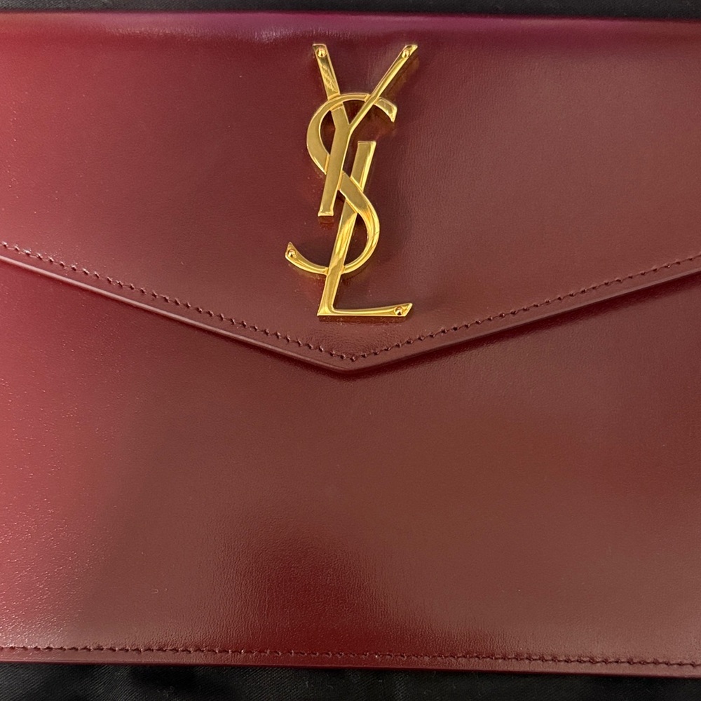 Yves Saint Laurent Burgundy Clutch with Gold Logo